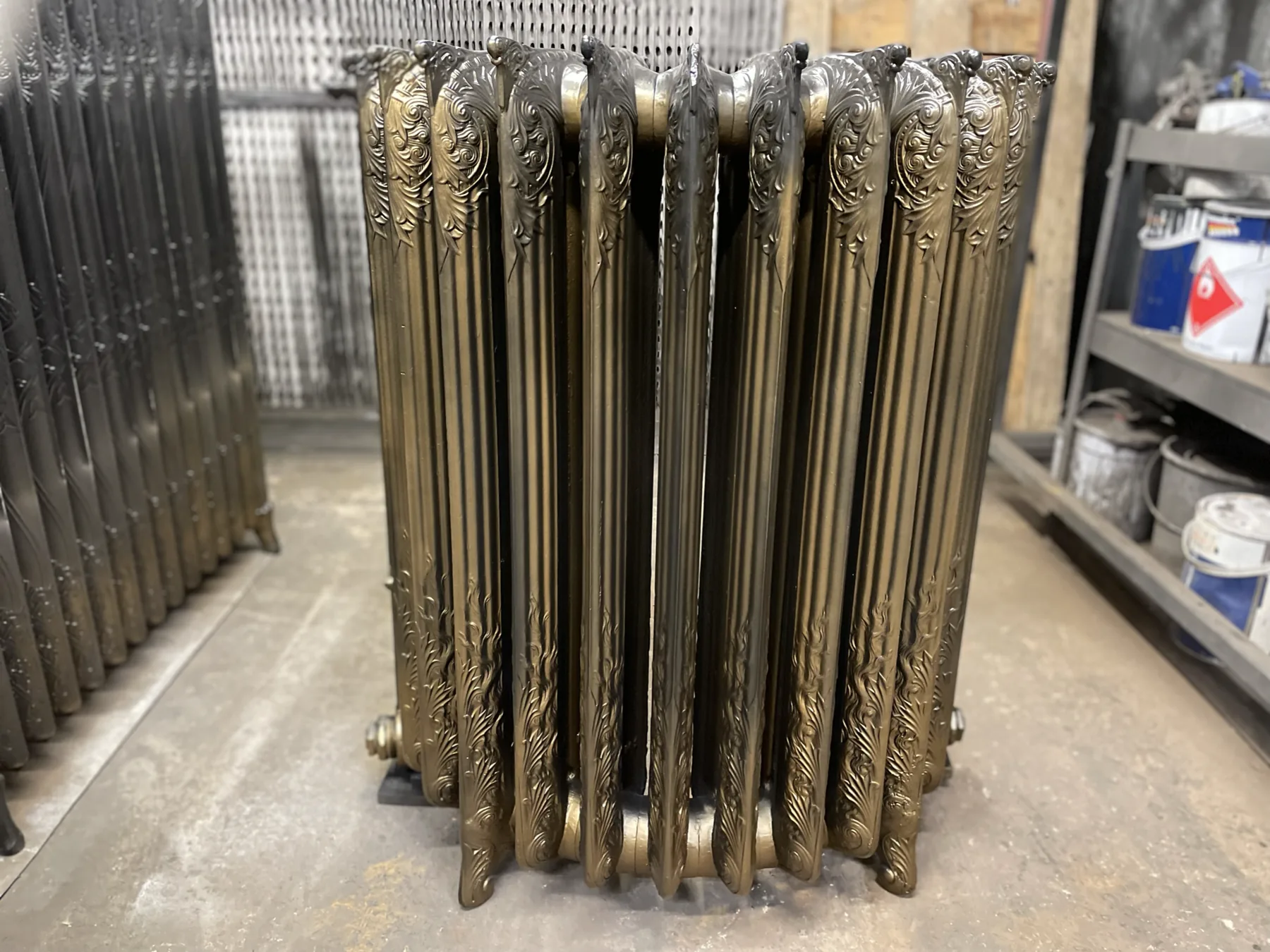 Fully restored Municipal Hotel cast iron radiator finished in aged gold